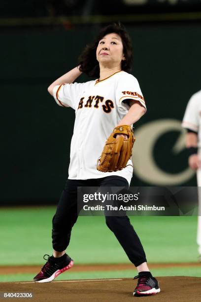 Internal Affairs and Communications Minister Seiko Noda throws the memorial first pitch prior to the game between Yomiuri Giants and Hanshin Tigers...