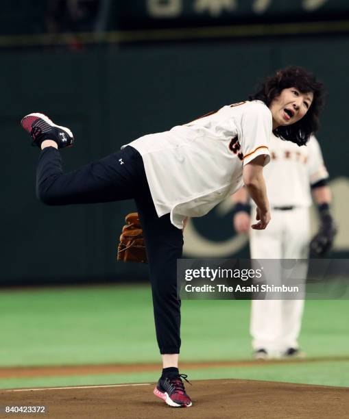 Internal Affairs and Communications Minister Seiko Noda throws the memorial first pitch prior to the game between Yomiuri Giants and Hanshin Tigers...