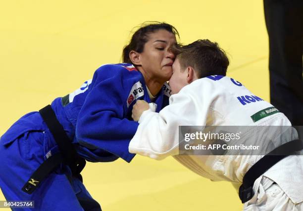 Germanys Nieke Nordmeyer competes with Brazil's Sarah Menezes during the womens -52kg category at the World Judo Championships in Budapest on August...