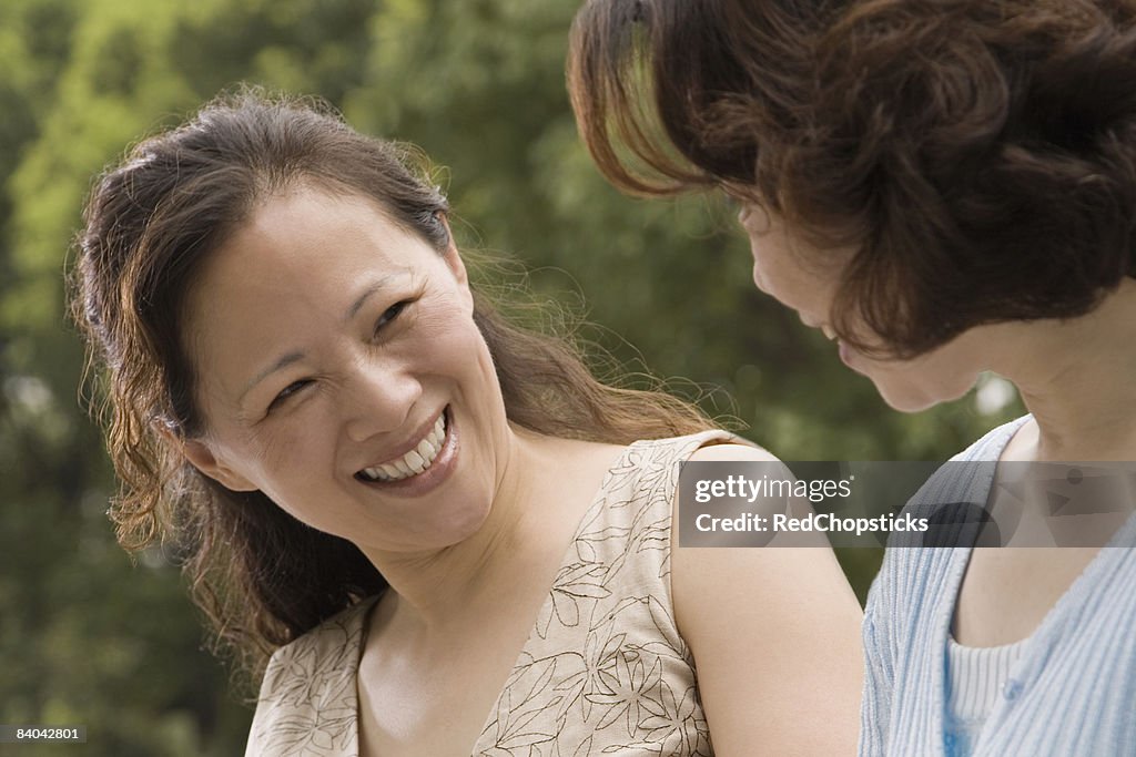 Close-up of two mature women smiling