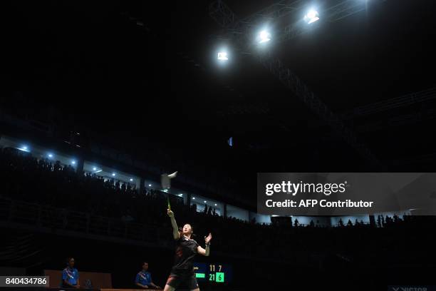 Soniia Cheah of Malaysia hits a return against Goh Jin Wei of Malaysia during the women's singles badminton final at the 29th Southeast Asian Games...