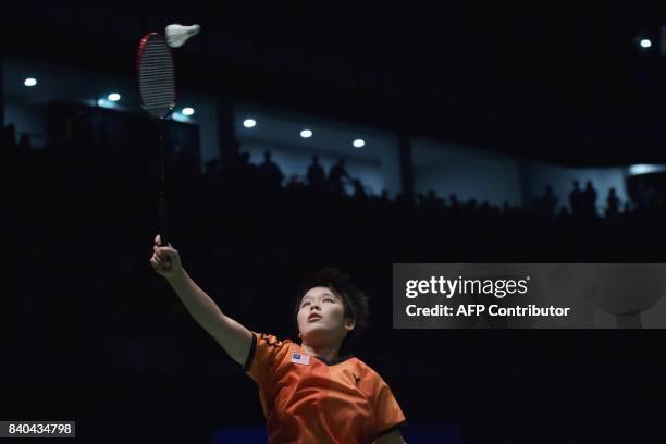 Goh Jin Wei of Malaysia hits a return against Soniia Cheah of Malaysia during the women's singles badminton final at the 29th Southeast Asian Games...