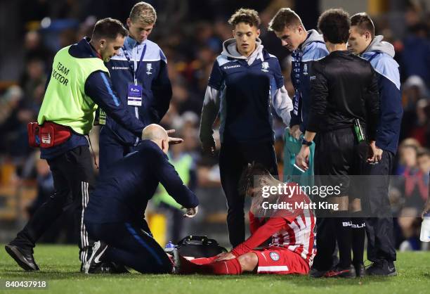 Bruno Fornaroli of Melbourne City is assisted onto a stretcher after sustaining an injury during the FFA Cup round of 16 match between Hakoah Sydney...