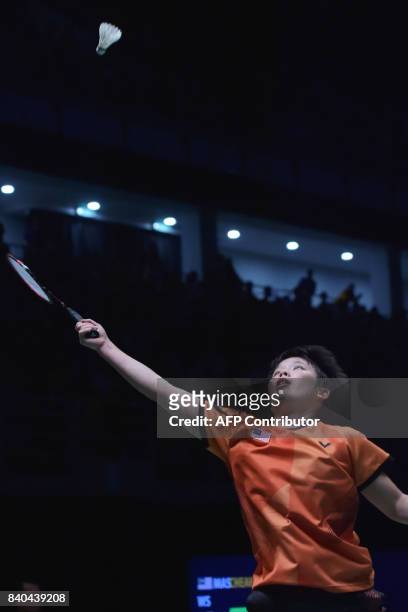 Goh Jin Wei of Malaysia hits a return against Soniia Cheah of Malaysia during the women's singles badminton final at the 29th Southeast Asian Games...