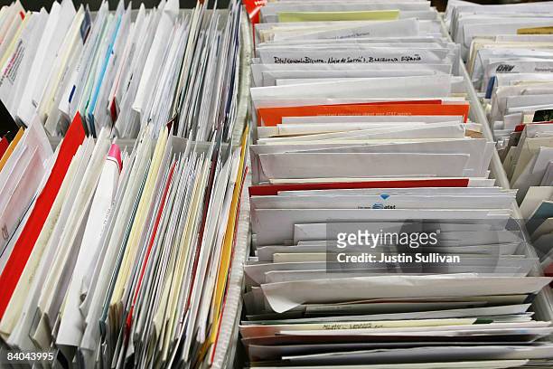 Boxes holding cards and letters are seen at the U.S. Post Office sort center December 15, 2008 in San Francisco, California. On its busiest day of...