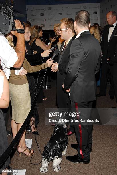 Sir Elton John, David Furnish and Arthur their pet English Cocker Spaniel