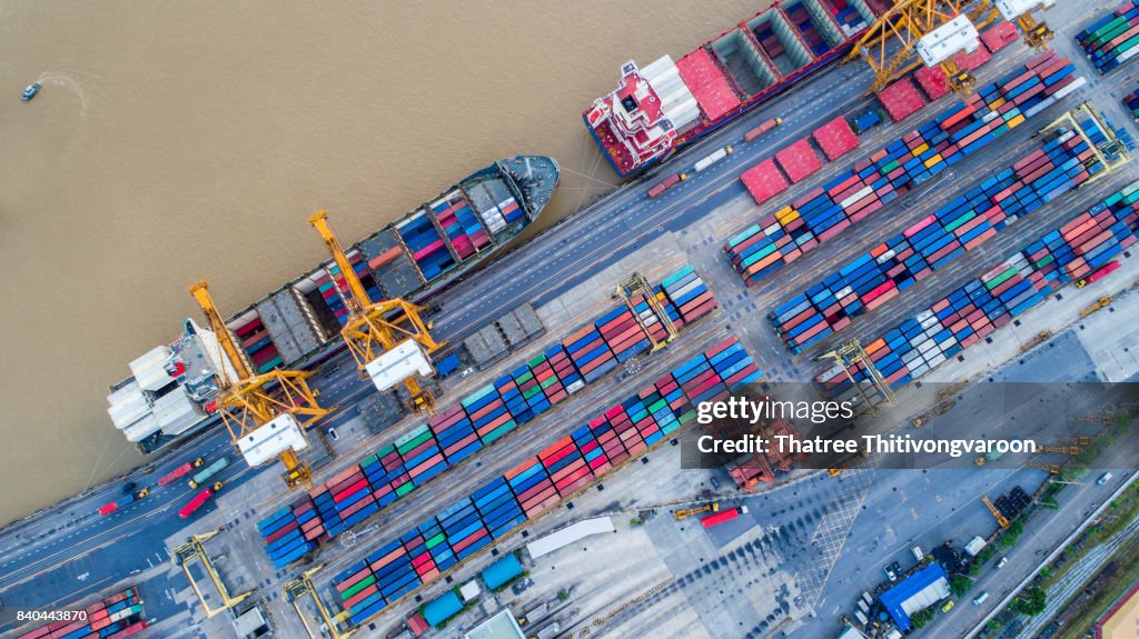 Container ship in import export and business logistic, By crane, Trade Port, Shipping cargo to harbor, Aerial view from drone, International transportation, Business logistics concept