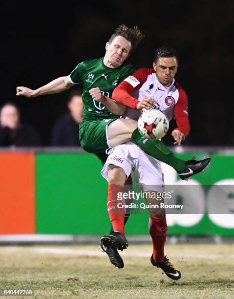 Joshua Risdon of the Wanderers and Luke Pilkington of Bentleigh compete for the ball during the round of 16 FFA Cup match between Bentleigh Greens...