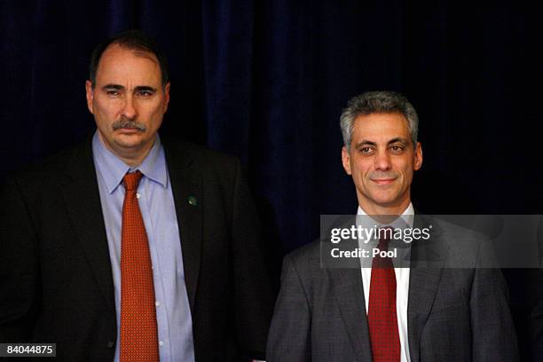 Senior Advisor David Axelrod and Chief of Staff-designate Rahm Emanuel listen as President-elect Barack Obama answers questions from the media after...