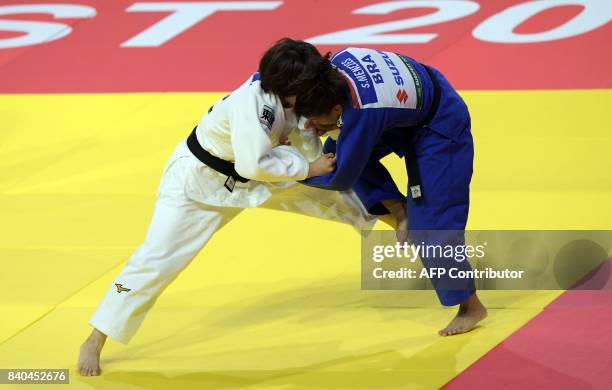 Japan's Ai Shishime competes with Brasil's Sarah Menezes during their match in the womens -52kg category at the World Judo Championships in Budapest...