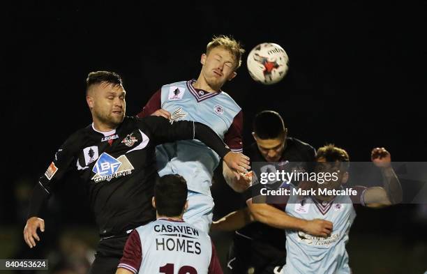 Nathan Millgate of APIA Leichhardt Tigers wins a header during the round of 16 FFA Cup match between Blacktown City and APIA Leichhardt Tigers at...