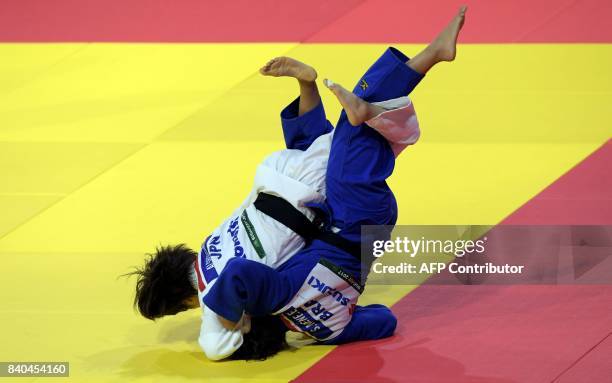 Japan's Ai Shishime competes with Brazil's Sarah Menezes during their match in the womens -52kg category at the World Judo Championships in Budapest...