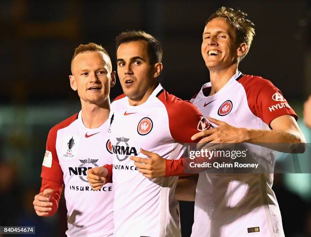 Steven Lustica of the Wanderers is congratulated by team mates after scoring a goal during the round of 16 FFA Cup match between Bentleigh Greens and...