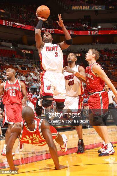 Dwyane Wade of the Miami Heat shoots against Luc Mbah a Moute of the Milwaukee Bucks on December 15, 2008 at the American Airlines Arena in Miami,...