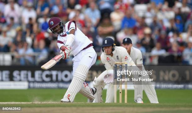 West Indies batsman Kraigg Brathwaite hits out as Jonathan Bairstow reacts during day five of the 2nd Investec Test Match between England and West...