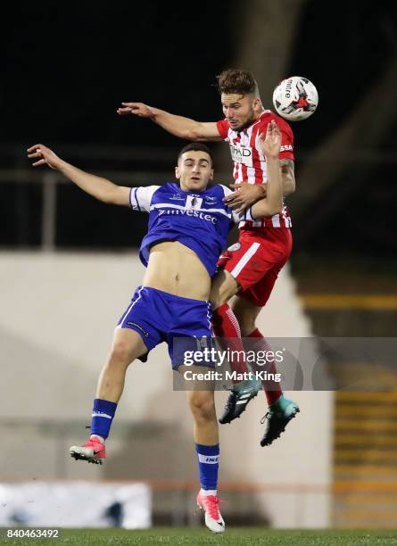 Anthony Frangie of Hakoah is challenged by Bart Schenkeveld of Melbourne City during the FFA Cup round of 16 match between Hakoah Sydney City East...