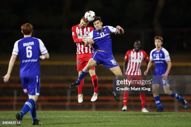 Luke Brattan of Melbourne City competes for the ball against Oliver Green of Hakoah during the FFA Cup round of 16 match between Hakoah Sydney City...