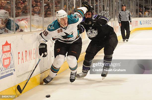 Ryane Clowe of the San Jose Sharks pushes away Kyle Quincey of the Los Angeles Kings during the game on December 15, 2008 at Staples Center in Los...