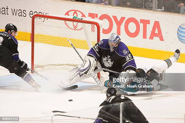 Tomas Plihal of the San Jose Sharks slides past the net after attempting a shot on goal against Jason LaBarbera of the Los Angeles Kings during the...