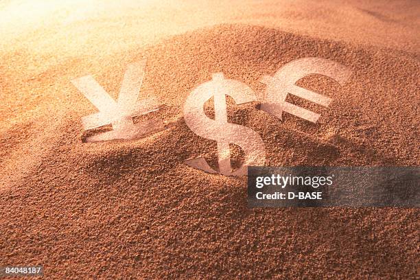 currency sign is buried in the sand - y 3 stock pictures, royalty-free photos & images