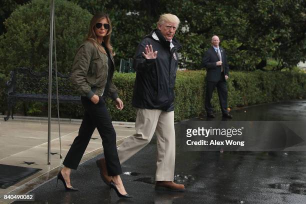 President Donald Trump walks with first lady Melania Trump prior to their Marine One departure from the White House August 29, 2017 in Washington,...