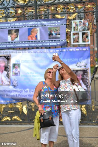 People commemorate the 20th anniversary of Princess Diana by laying flowers and tributes at Kensington Palace on August 29, 2017 in London, England....