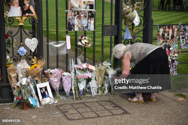 People commemorate the 20th anniversary of Princess Diana by laying flowers and tributes at Kensington Palace on August 29, 2017 in London, England....