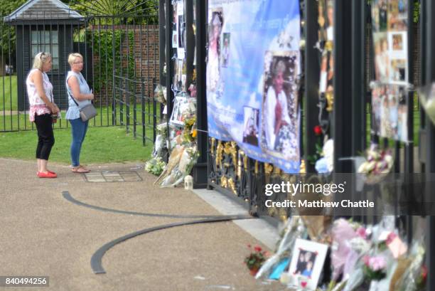 People commemorate the 20th anniversary of Princess Diana by laying flowers and tributes at Kensington Palace on August 29, 2017 in London, England....
