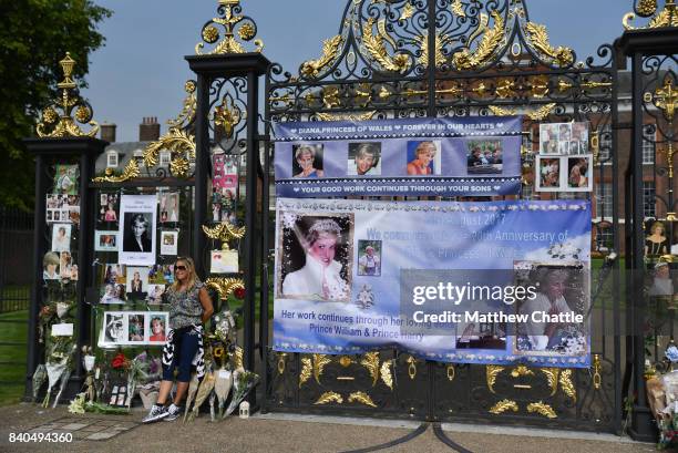 People commemorate the 20th anniversary of Princess Diana by laying flowers and tributes at Kensington Palace on August 29, 2017 in London, England....