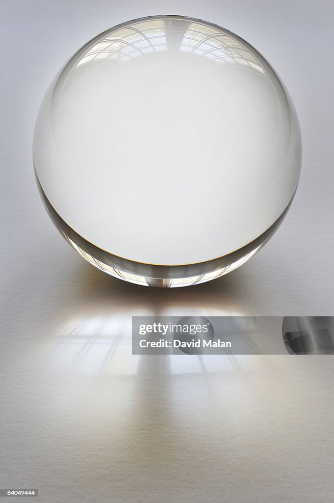 Crystal ball on white surface