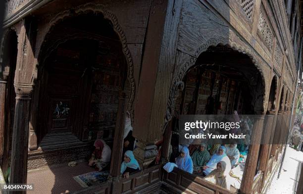 Kashmiri Muslim women pray at the shrine of Khaniqahi mullah during a festival on August 29, 2017 in Srinagar, the summer capital of Indian...