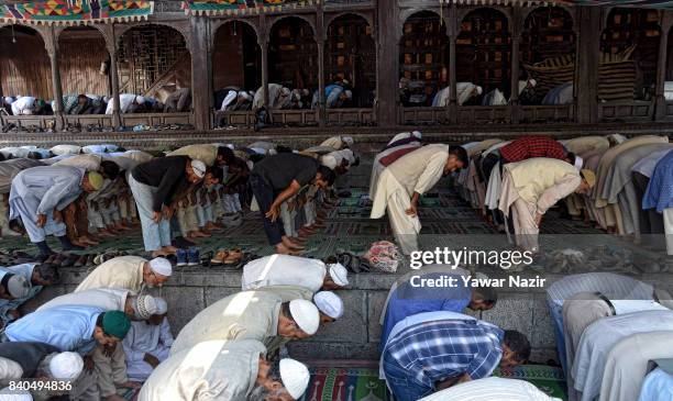 Kashmiri Muslims pray at the shrine of Khaniqahi mullah during a festival on August 29, 2017 in Srinagar, the summer capital of Indian administered...