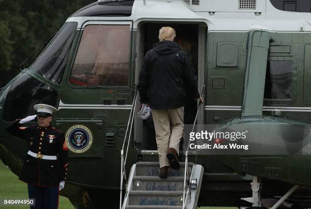 President Donald Trump boards Marine One prior to a departure from the White House August 29, 2017 in Washington, DC. President Trump was traveling...
