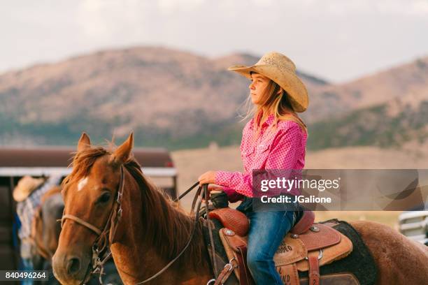 young teenage cowgirl sitting on her horse looking off into the distance - salt lake city stock pictures, royalty-free photos & images