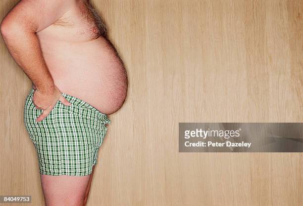 profile of obese man - belly fat stock pictures, royalty-free photos & images