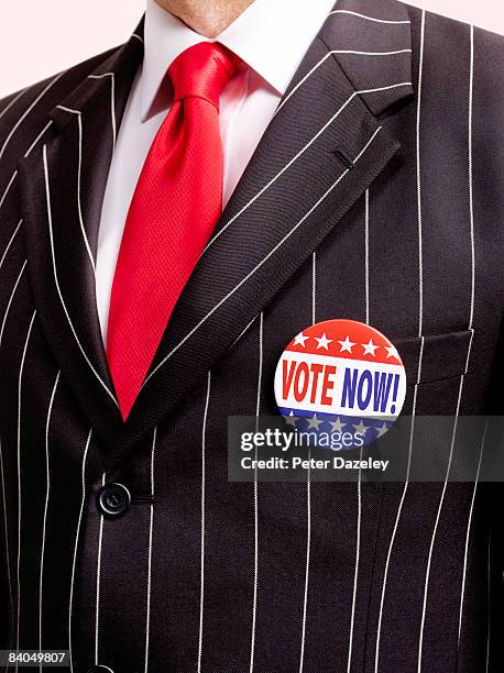 vote for now badge with pin stripe suit - pinstripe fotografías e imágenes de stock