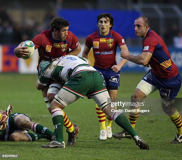 Nathan Hines of Perpignan is tackled by Jordan Crane of Leicester Tigers during the Heineken Cup match between Perpignan and Leicester Tigers at...