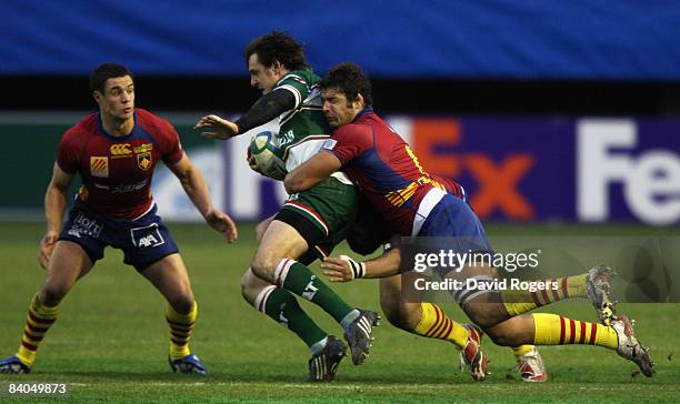 Matt Smith of Leicester is tackled by Damien Chouly of Perpignan during the Heineken Cup match between Perpignan and Leicester Tigers at Stade Aime...