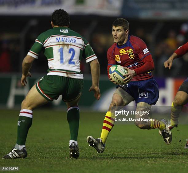 Christophe Manas of Perpigan runs with the ball during the Heineken Cup match between Perpignan and Leicester Tigers at Stade Aime Giral on December...