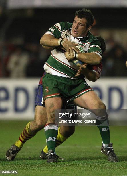 Julian White of Leicester is tackled during the Heineken Cup match between Perpignan and Leicester Tigers at Stade Aime Giral on December 14, 2004 in...