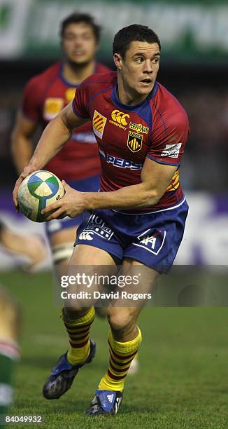 Dan Carter of Perpignan runs with the ball during the Heineken Cup match between Perpignan and Leicester Tigers at Stade Aime Giral on December 14,...