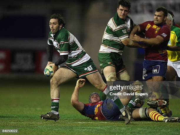 Julien Dupuy of Leicester runs with the ball during the Heineken Cup match between Perpignan and Leicester Tigers at Stade Aime Giral on December 14,...