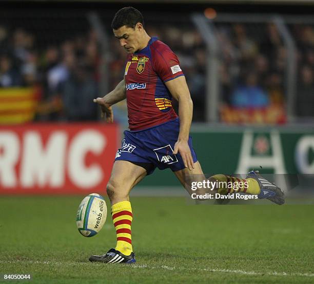 Dan Carter of Perpignan kicks the ball upfield during the Heineken Cup match between Perpignan and Leicester Tigers at Stade Aime Giral on December...