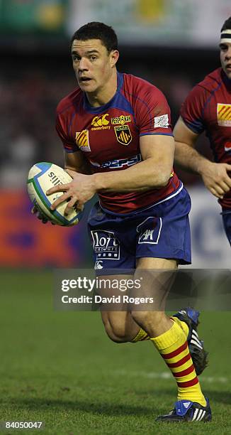 Dan Carter of Perpignan runs with the ball during the Heineken Cup match between Perpignan and Leicester Tigers at Stade Aime Giral on December 14,...