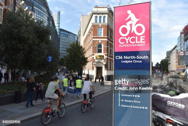 Cyclists ride on the C56 North-South cycle superhighway cycle lane at Ludgate Circus on August 25, 2017 in London, England.