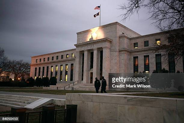 Flags fly over the Federal Reserve Building on December 16, 2008 in Washington, D.C. The Fed began its last meeting of 2008 today, where it is...