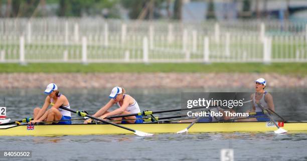 Annie Vernon, Debbie Flood, Frances Houghton and Katherine Grainger of Great Britain exhausted after finishing second in the Women's Quadruple Sculls...