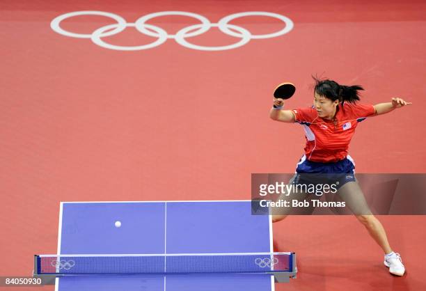 Chen Wang of the United States plays against Iulia Necula of Romania during their Women's Team Bronze Play-off Round 1 match at the Peking University...