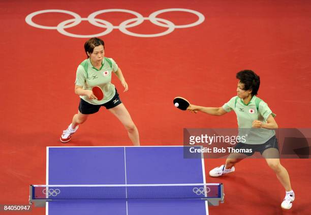 Japan's table tennis players Sayaka Hirano and Haruna Fukuoka play a point against Austria's Li Qiangbing and Veronika Heine during the women's team...