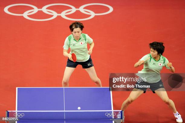 Japan's table tennis players Sayaka Hirano and Haruna Fukuoka play a point against Austria's Li Qiangbing and Veronika Heine during the women's team...